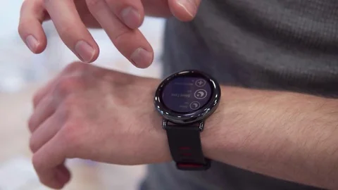 Hand touches smart watch Stock Footage
