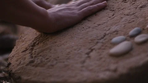 Hand touches stone Stock Footage 114839379