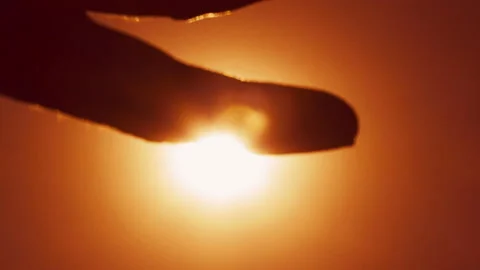 The hand touches the sun Stock Footage 102102791