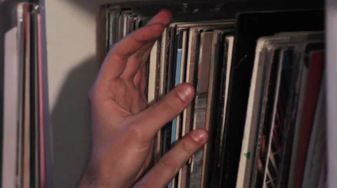Hand touches vinyl Stock Footage 45340335