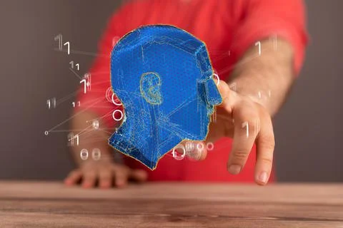 Hand touching a 3D floating human head - artificial intelligence concept Stock Photos