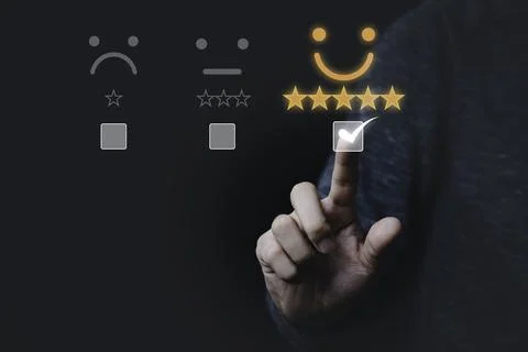 Hand touching and doing mark to select smiley face icon for evaluate product Stock Photos