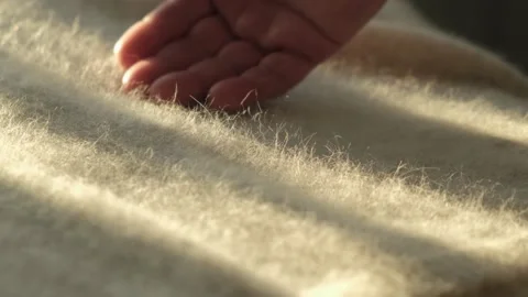 Hand touching anro fluffy woolen fabric, close-up 库存影片 199387857