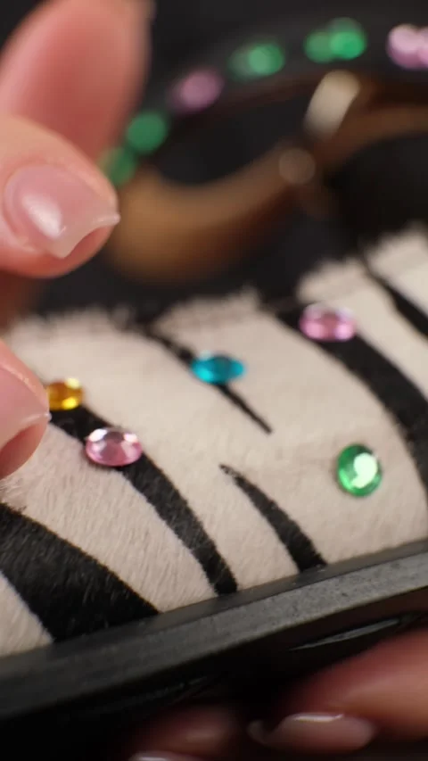 Hand Touching Beaded Zebra Pattern Shoe Stock Footage 303773462