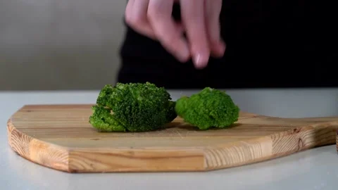 A hand touching cauliflower vegetable, close-up cauliflower, Juicy green Video stock 153527083