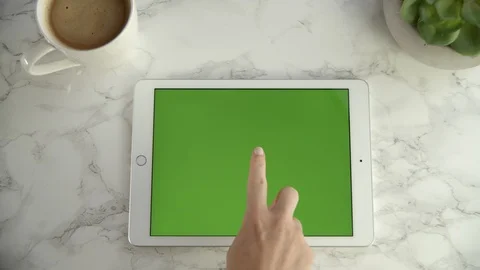 Hand touching centre of green screen tablet on granite table, 4k Video stock 112227537