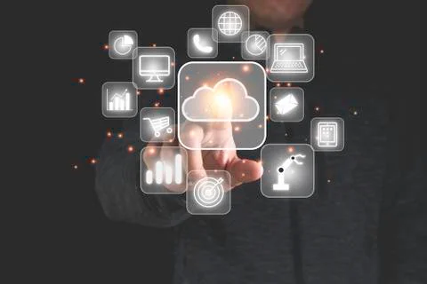 Hand touching cloud computing with technology icons such as laptop computer Stock Photos