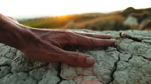 Hand Touching Cracked Dry Ground Stock Footage 242860712