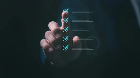 Hand touching digital checklist with checkmarks on screen Stock-Fotos