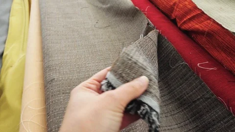Hand touching fabric - comparison - cushion - curtains Stock Footage 106757114