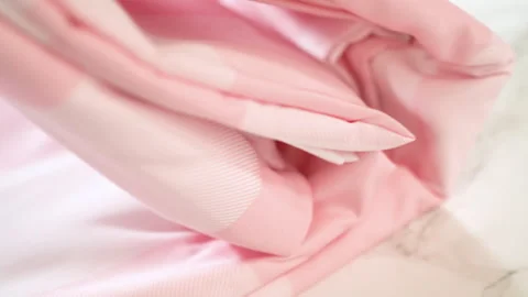 Hand Touching Folded Pink Bedding Fabric Stock Footage 316957036