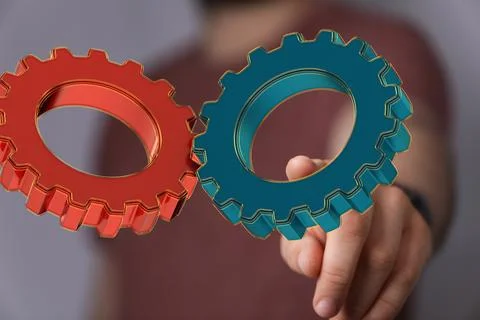 Hand touching gears - the concept of an engineering Stock Photos