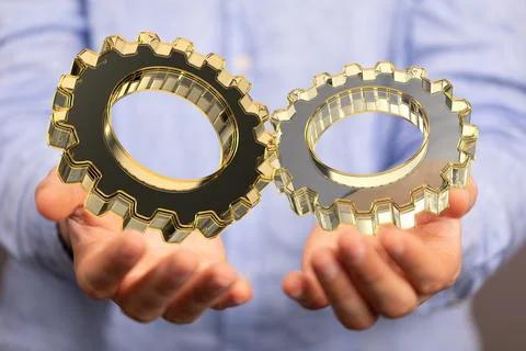 Hand touching gears - the concept of an engineering Stock Photos
