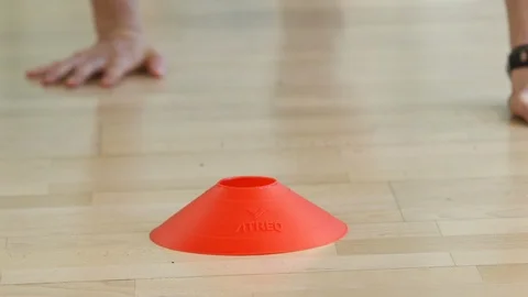 Hand touching gym cone Stock Footage 103328002