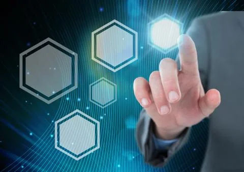 Hand touching icons interface of hexagons glowing Stock Photos