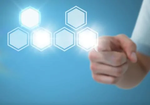 Hand touching icons interface of hexagons Stock Photos