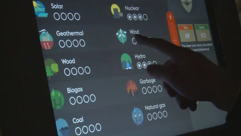 Hand touching interactive screen of renewable electricity energy production Stock Footage 78642696