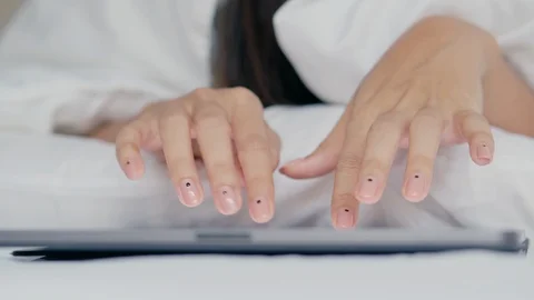 Hand touching keyboard on modern digital tablet on the bedroom Stock Footage 112139050