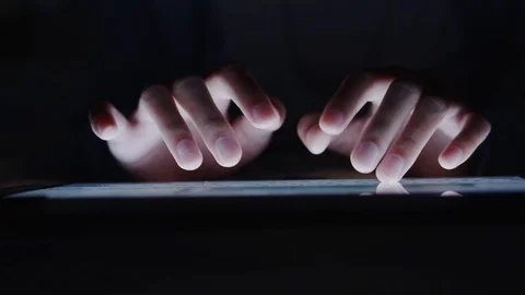 Hand touching keyboard on modern digital tablet in the night Stock Footage 118996735