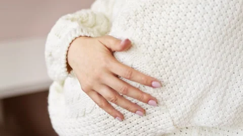 Hand touching knitted wool cloth warm white sweater. Stock Footage 211732604