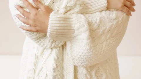 Hand touching knitted wool cloth white sweater Stock Footage 211732645