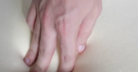 Hand is touching a memory foam mattress Stock Footage