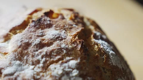 A hand is touching a piece of bread with a white crust Video stock 305647398