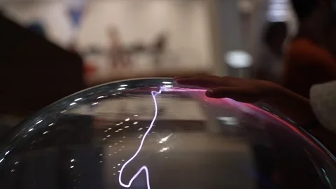 Hand Touching Reflective Metallic Surface with Colorful Light Reflections 스톡 동영상 346887007