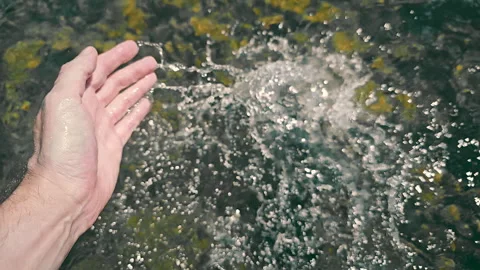 Hand Touching Refreshing Water, A hand reaching into a clear and refreshing body Stock Footage 279064727