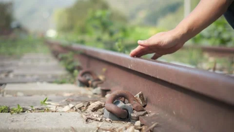 Hand Touching a Rusty Railway Track Stock-Footage 346758316