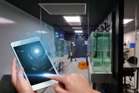 Hand Touching Screen Of Mobile Phone In Laboratory Showing Futuristic Techn.. Stock Photos