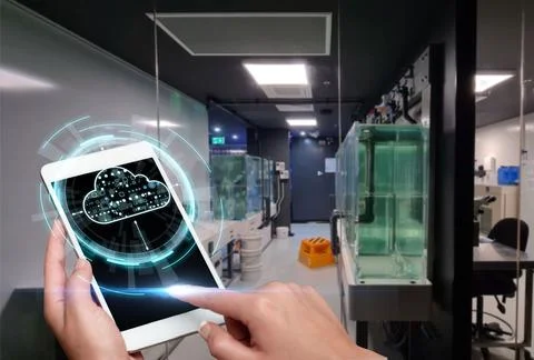 Hand Touching Screen Of Mobile Phone In Laboratory Showing Futuristic Techn.. Stock Photos