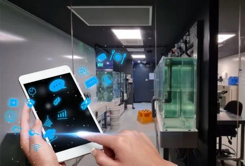 Hand Touching Screen Of Mobile Phone In Laboratory Showing Futuristic Techn.. Stock Photos