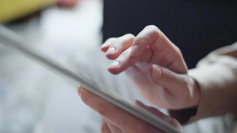 Hand touching screen on modern digital tablet pc. Hands using digital tablet Stock Footage 134944330