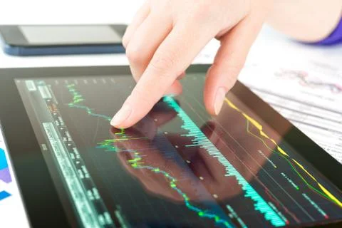 Hand touching screen of tablet pc Fotos Stock