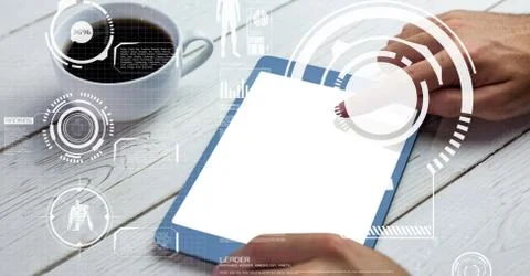 Hand touching screen of tablet PC on table Foto stock