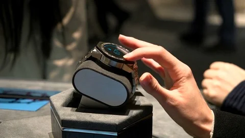Hand touching smartwatch exhibited at Tag Heuer booth at Baselworld. Stock Footage 81438574