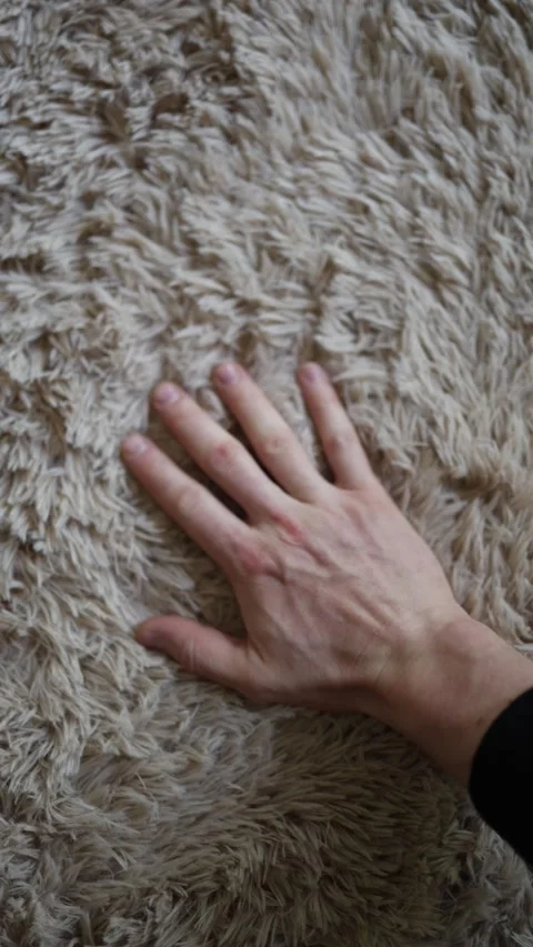 Hand touching soft fluffy carpet Stock Footage 336927653