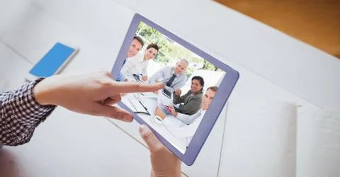 Hand touching tablet PC while video conferencing Stock Photos