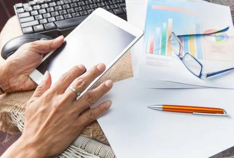 Hand touching on tablet screen use for modern people lifestyle and on line co Stock-Fotos