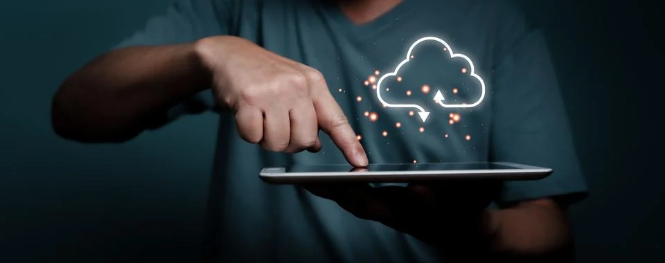 Hand touching tablet with white cloud computing network technology concept.. Stock Photos