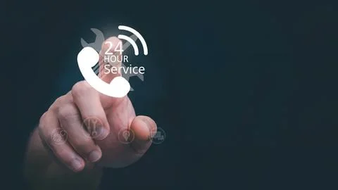 Hand touching virtual 24 hour service icon on dark background Stock Photos