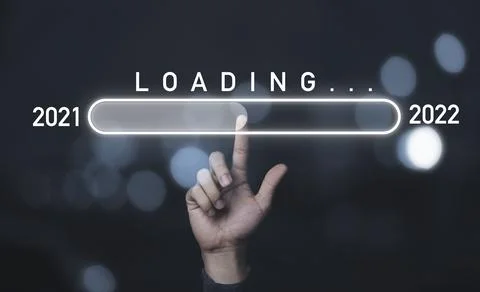 Hand touching to virtual infographic loading for change 2021 to 2022 Stock Photos