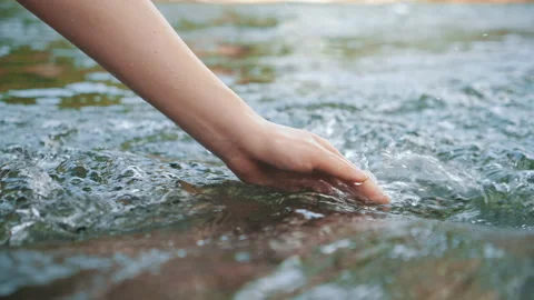 Hand touching water in the forest river or lake 스톡 동영상 155430334