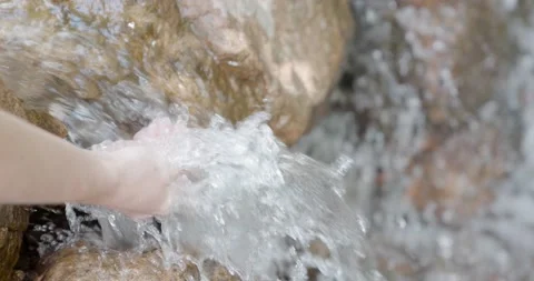 Hand touching water in the river or lake travel enjoying nature life concept Stock Footage 147878657