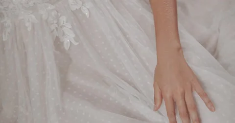 Hand touching a wedding dress Stock Footage 157789448
