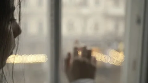 Hand touching window Stock Footage 167652075