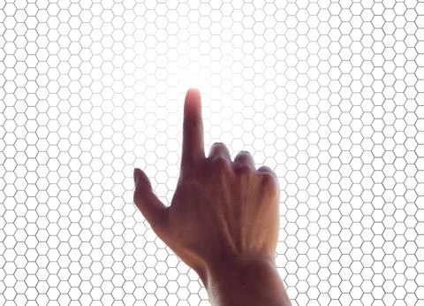 Hand on  a touchscreen grid Stock Photos