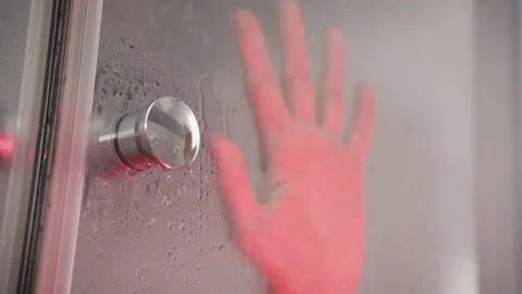 Hand on the transparent shower door Video stock 197288119