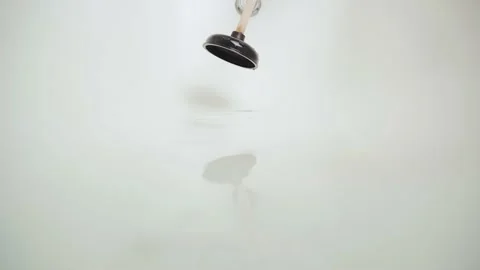 Hand tries to use a plunger to break through the blockage in the bathroom with Video stock 166883401